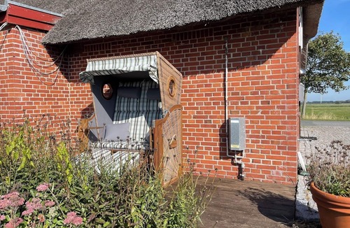 Fahretoft House | "Experience Relaxation and Adventure at Ferienhaus Haus Nordwind 1849!"