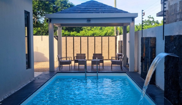 Serenity I Villa : 4 Ensuite Bedrooms, Heated Pool Feature & Cozy Living Spaces.